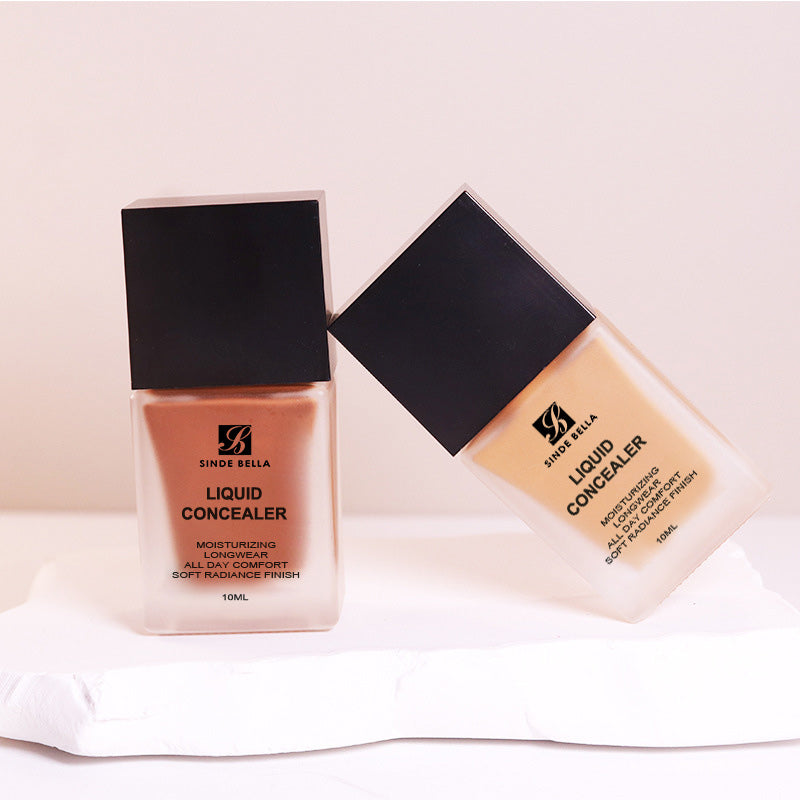 Correcteur liquide longue durée à couvrance légère à moyenne